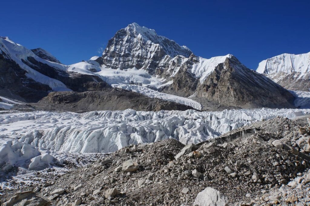 A Himalayan glacier with crevassed ice and rocky moraine (representative image)