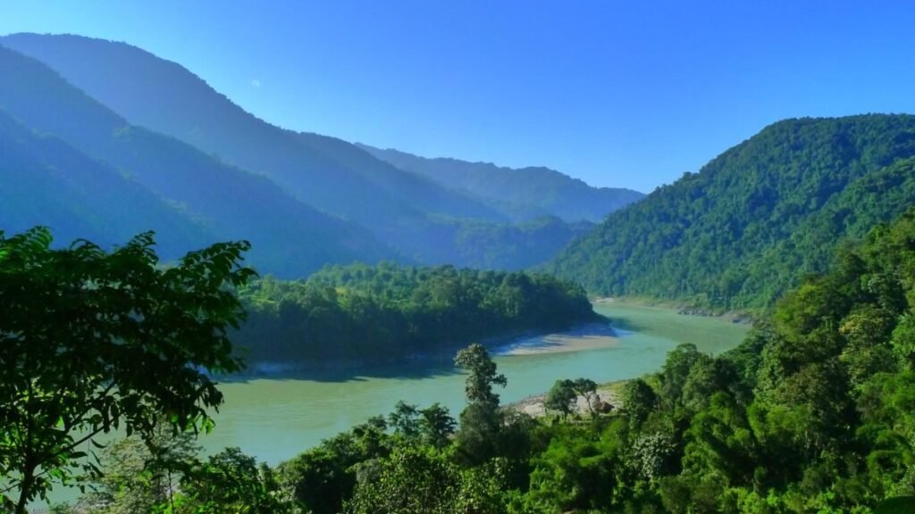 Scenic view of the Siang river winding through forested mountains in Arunachal Pradesh
