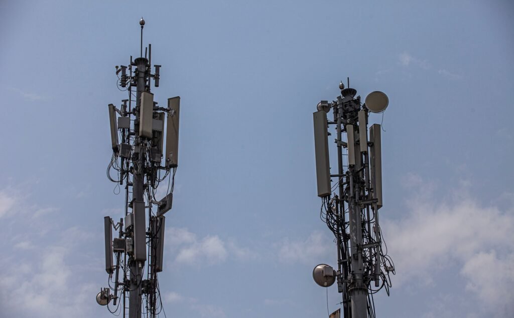 Mobile telecom towers against a clear sky